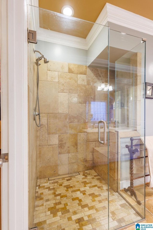 bathroom featuring walk in shower and ornamental molding