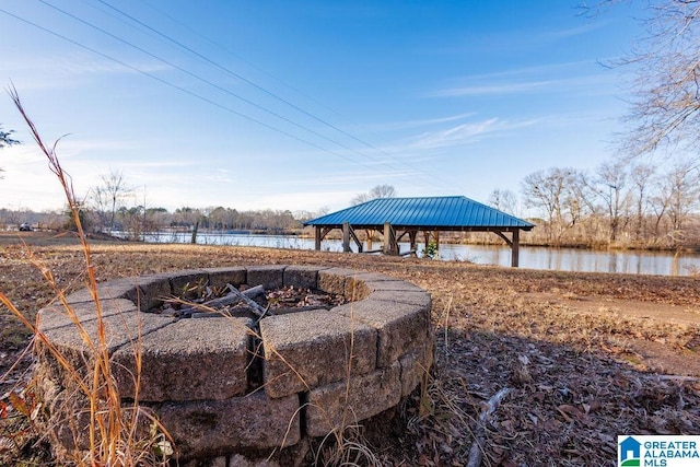 exterior space featuring a gazebo and a water view