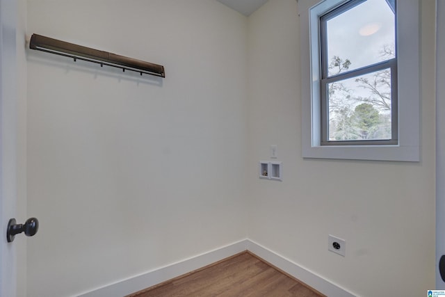 laundry area with hookup for an electric dryer, hardwood / wood-style floors, and hookup for a washing machine