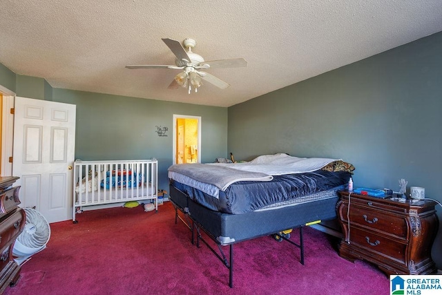 bedroom featuring ceiling fan, carpet, and a textured ceiling