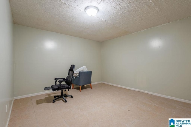 unfurnished office with a textured ceiling