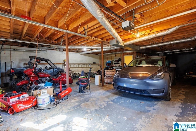 garage featuring a garage door opener