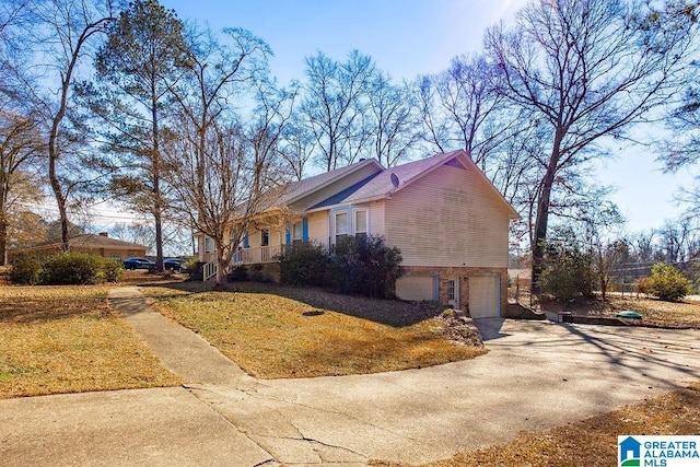 view of property exterior featuring a garage and a yard