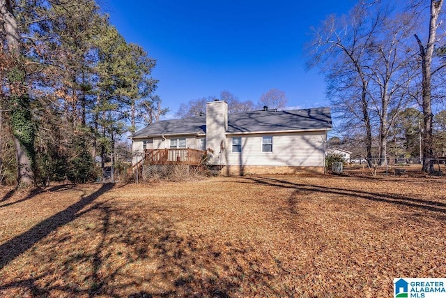 back of house featuring a deck