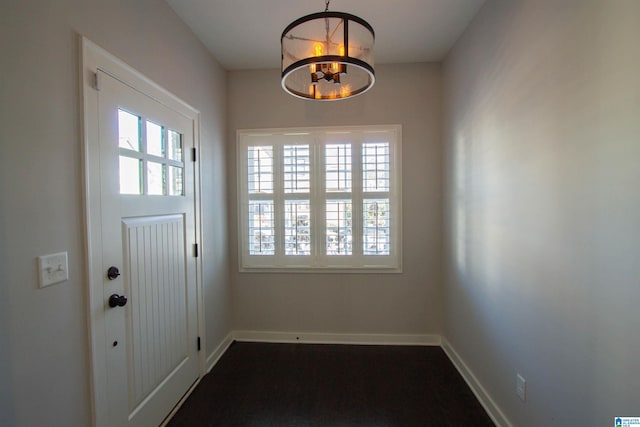 entryway featuring an inviting chandelier