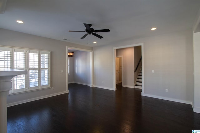 empty room featuring ceiling fan and dark hardwood / wood-style floors