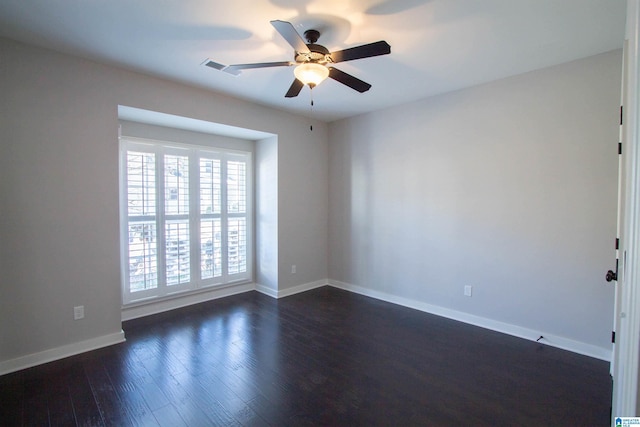 empty room featuring dark hardwood / wood-style floors and ceiling fan