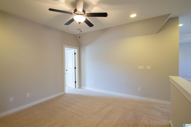 unfurnished room featuring light carpet and ceiling fan