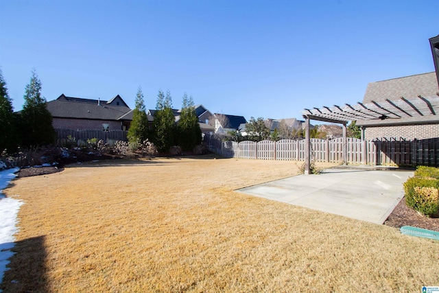 view of yard with a pergola and a patio area