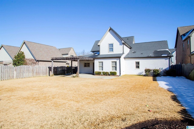 rear view of house with a pergola