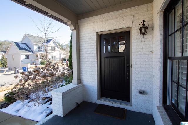 property entrance featuring covered porch