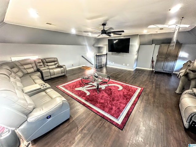 living room with dark hardwood / wood-style floors, ceiling fan, and vaulted ceiling