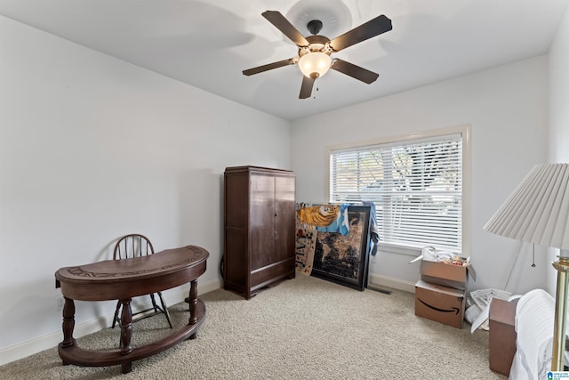 living area featuring ceiling fan and light carpet