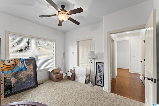 carpeted bedroom with ceiling fan