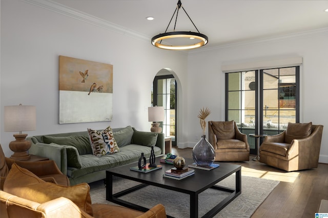 living room with light hardwood / wood-style floors and crown molding