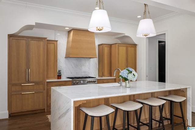 kitchen featuring a large island, pendant lighting, decorative backsplash, and custom range hood