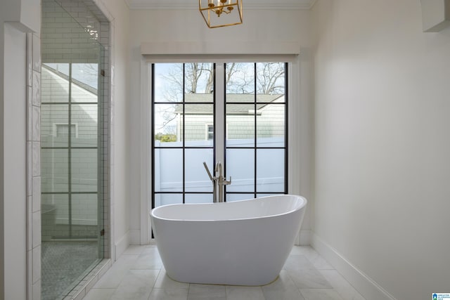 bathroom featuring shower with separate bathtub, tile patterned floors, a chandelier, and crown molding