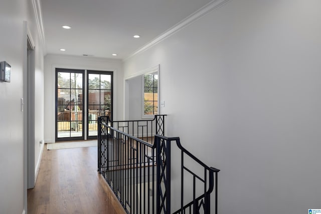 corridor featuring crown molding and hardwood / wood-style floors