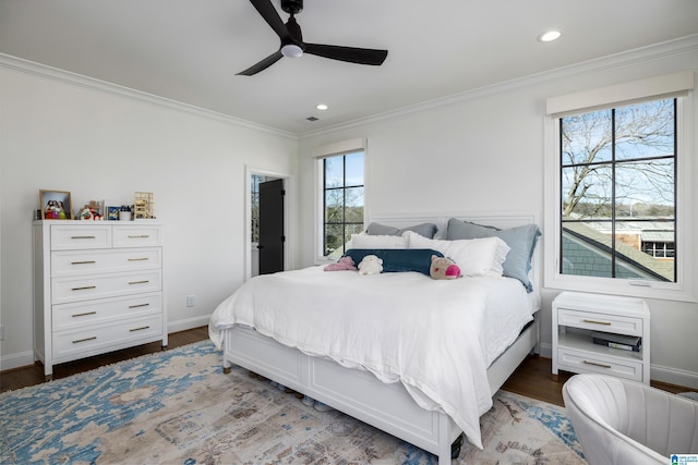 bedroom featuring ceiling fan, hardwood / wood-style floors, and ornamental molding