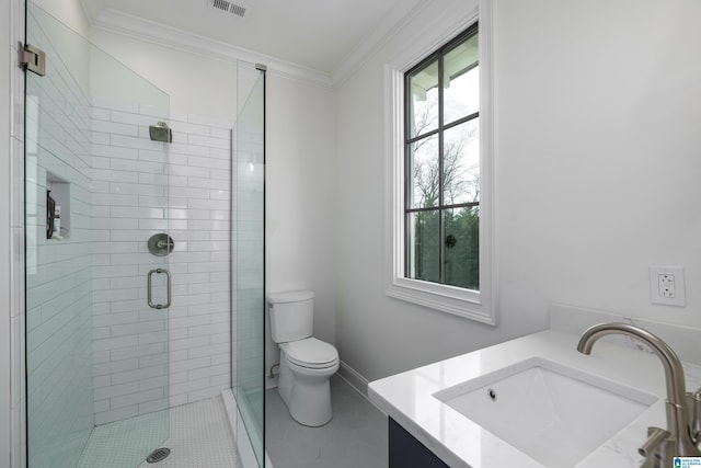 bathroom featuring toilet, walk in shower, tile patterned flooring, crown molding, and vanity