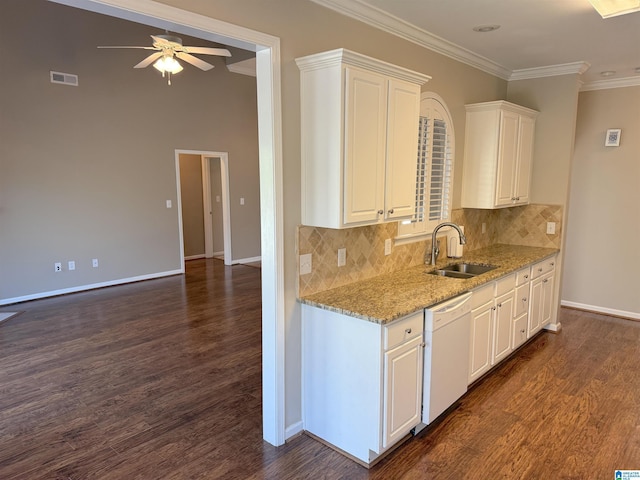 kitchen featuring dishwasher, white cabinets, sink, decorative backsplash, and light stone countertops