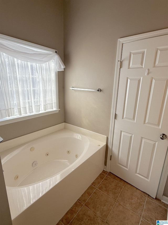 bathroom featuring a washtub and tile patterned floors