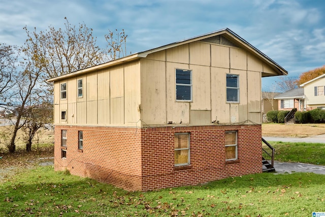 view of home's exterior with a yard