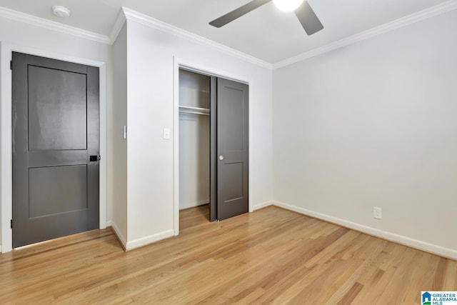 unfurnished bedroom with a closet, ceiling fan, light wood-type flooring, and ornamental molding