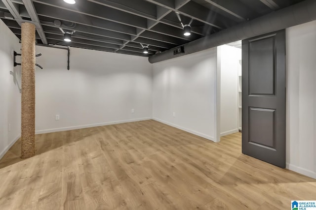 basement featuring light wood-type flooring