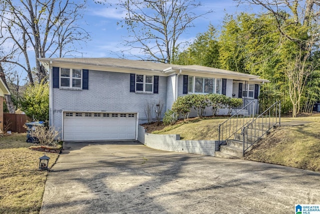 single story home featuring driveway, a garage, stairway, and brick siding