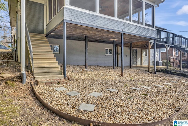 view of side of home with a sunroom