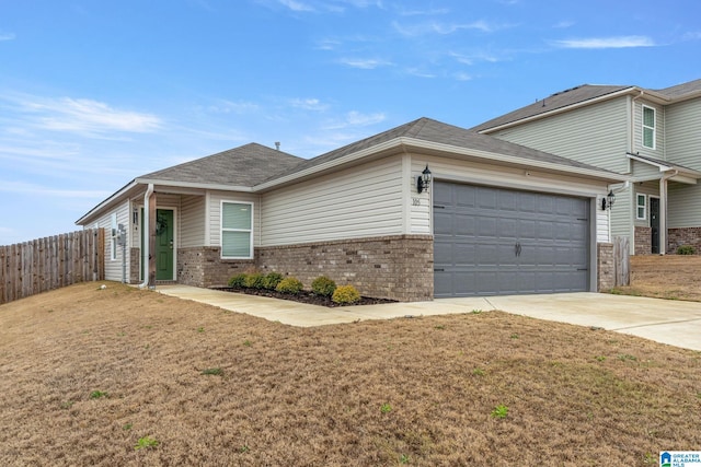 view of front facade with a front lawn and a garage