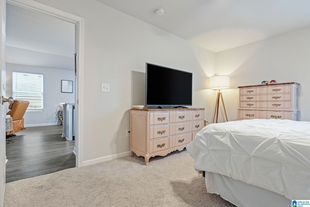 bedroom with dark colored carpet