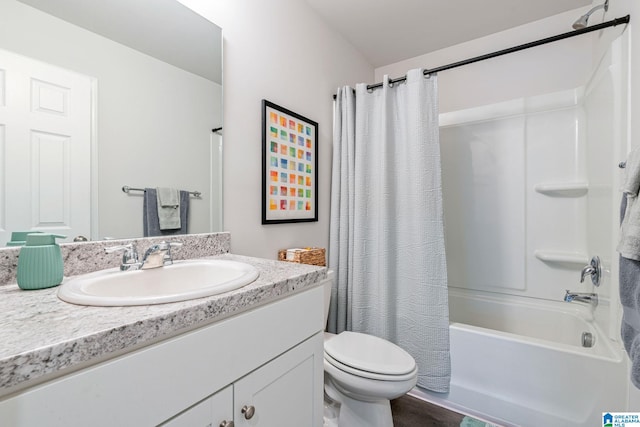 full bathroom with vanity, toilet, and shower / tub combo