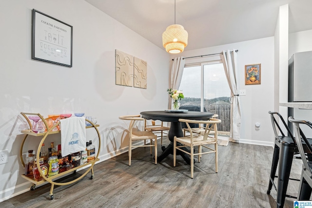 dining area with hardwood / wood-style flooring