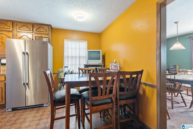 dining room with a textured ceiling