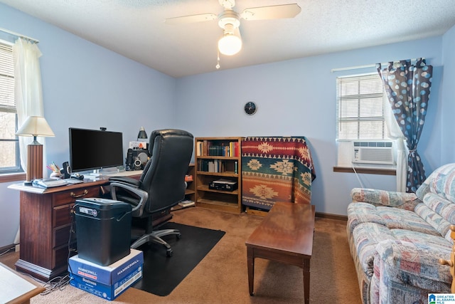 office space featuring cooling unit, ceiling fan, carpet, and a textured ceiling