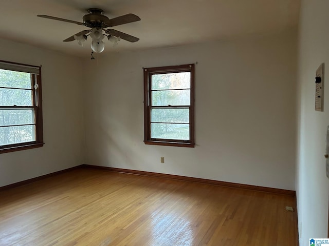 empty room featuring light hardwood / wood-style flooring and ceiling fan