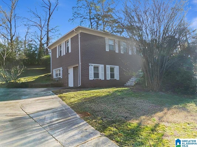 view of front facade with a garage and a front lawn