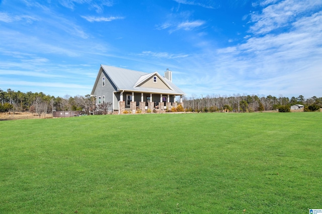 view of front of property featuring covered porch and a front lawn