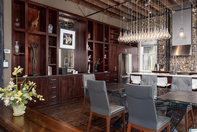 dining area with brick wall