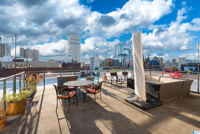 view of patio / terrace with a water view and an outdoor hangout area