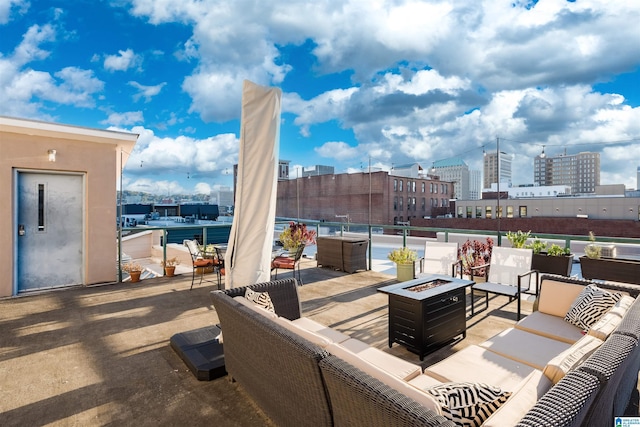 view of patio / terrace featuring an outdoor living space with a fire pit