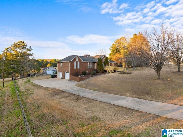 view of front of home with a wooden deck and a garage