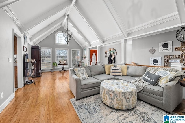 living room featuring lofted ceiling with beams, decorative columns, a chandelier, and light hardwood / wood-style flooring