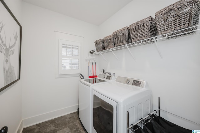 clothes washing area featuring washing machine and clothes dryer