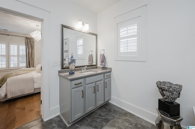 bathroom featuring vanity and a chandelier