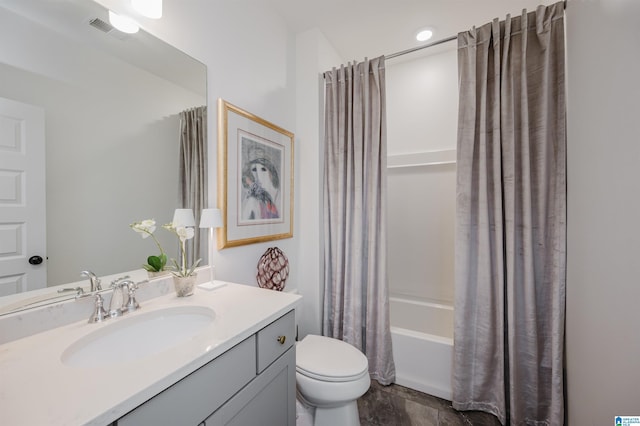 full bathroom featuring toilet, shower / bath combination with curtain, and vanity