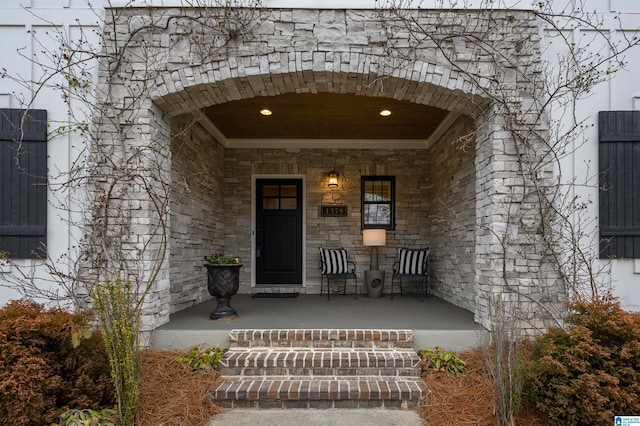 view of exterior entry featuring a porch