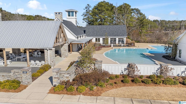 view of swimming pool featuring a patio and a gazebo